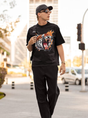 Black oversized t-shirt featuring a detailed graphic of an angry tiger bite t shirt with an open mouth and sharp teeth, part of the FlyyDok Graphicverse collection.